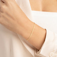 Load image into Gallery viewer, 14K Yellow Gold 2mm Serpentine Chain Bracelet with Lobster Lock, 7.5 Inches
