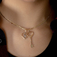 Load image into Gallery viewer, 14k Gold Love Written Open Heart Key Pendant
