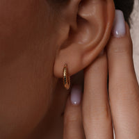 Load image into Gallery viewer, A Model is Styling with 14k Gold Round Vintage Shrimp Hoop Earrings
