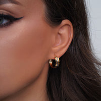 Load image into Gallery viewer, A Girl Worn 14k Gold Two Tone Diamond Cut Flat Hoop Earrings
