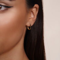 Load image into Gallery viewer, 14k Solid Gold Oval Shaped Clip Huggie Earrings
